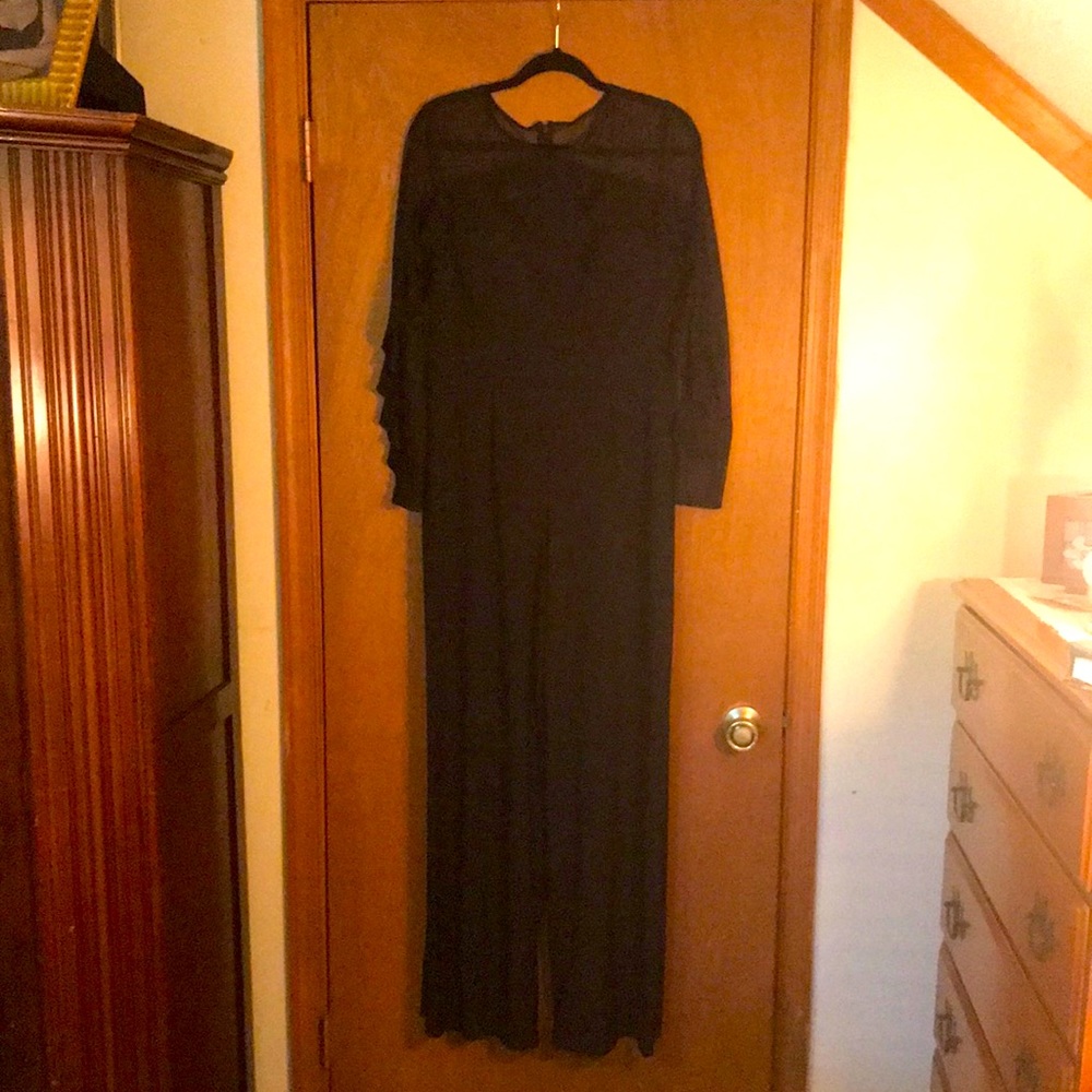 Frilled black jumpsuit w/sheer mesh sleeves + neck
